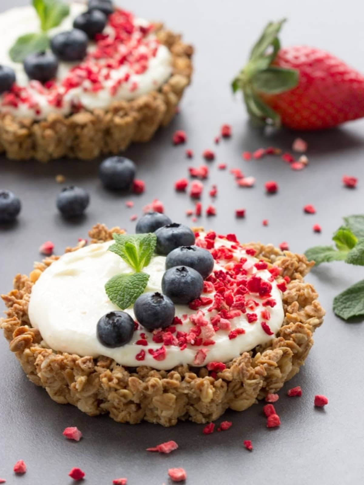 breakfast tart with mascarpone filling, granola crust, and berries.