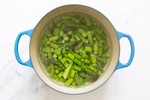 blanched asparagus in a pot of water.