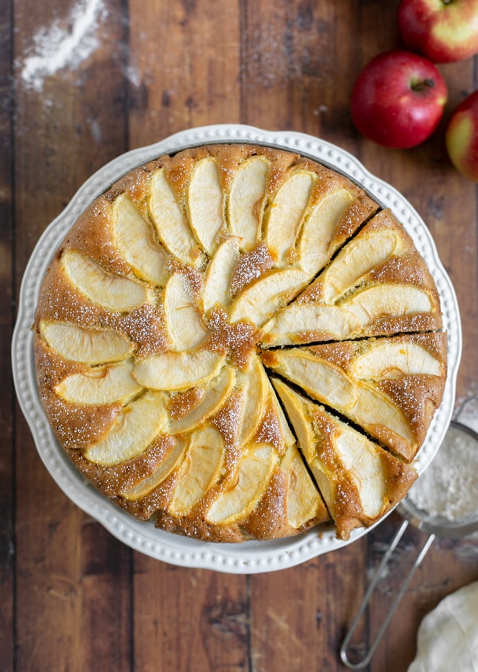 torta di mele, aka apple cake with sliced apples on top and dusted with confectioner's sugar.