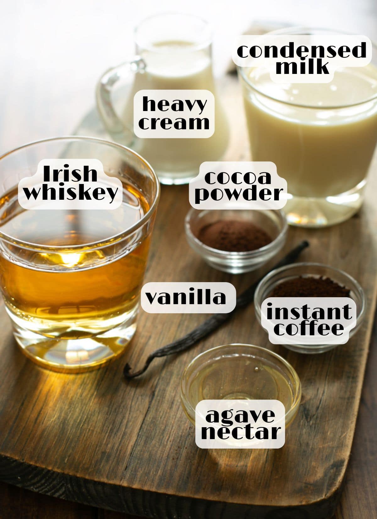 Ingredients for homemade Irish cream: Irish whiskey, heavy cream, sweetened condensed milk, cocoa powder, agave nectar, vanilla and instant coffee.
