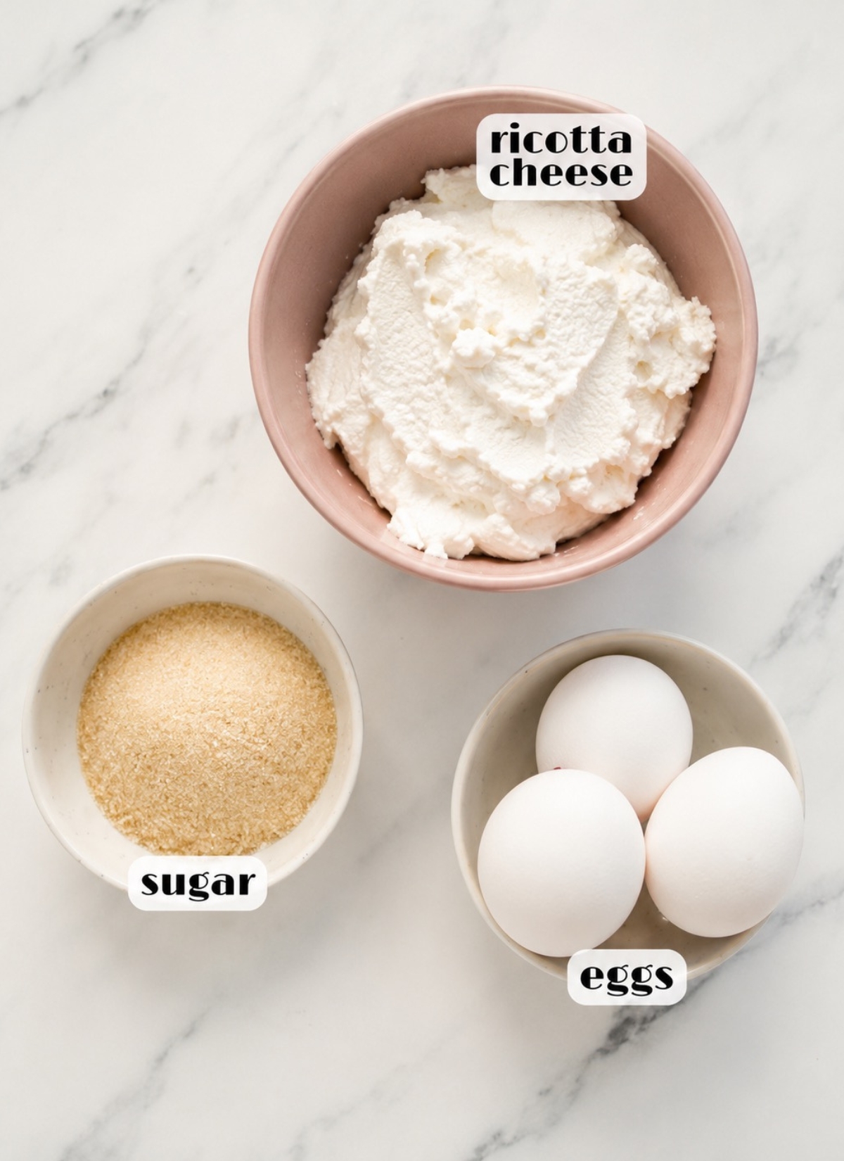 easy ricotta cheesecake ingredients: ricotta cheese, eggs, sugar.