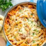 chicken bacon pasta bake in casserole pan. Image with text for Pinterest.