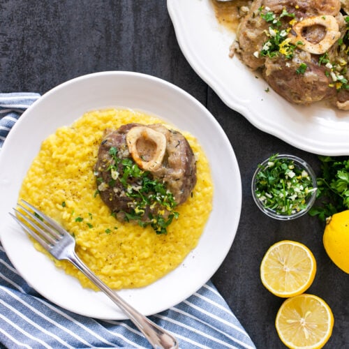 ossobuco alla milanese with gramolata, served with saffran risotto milanese.