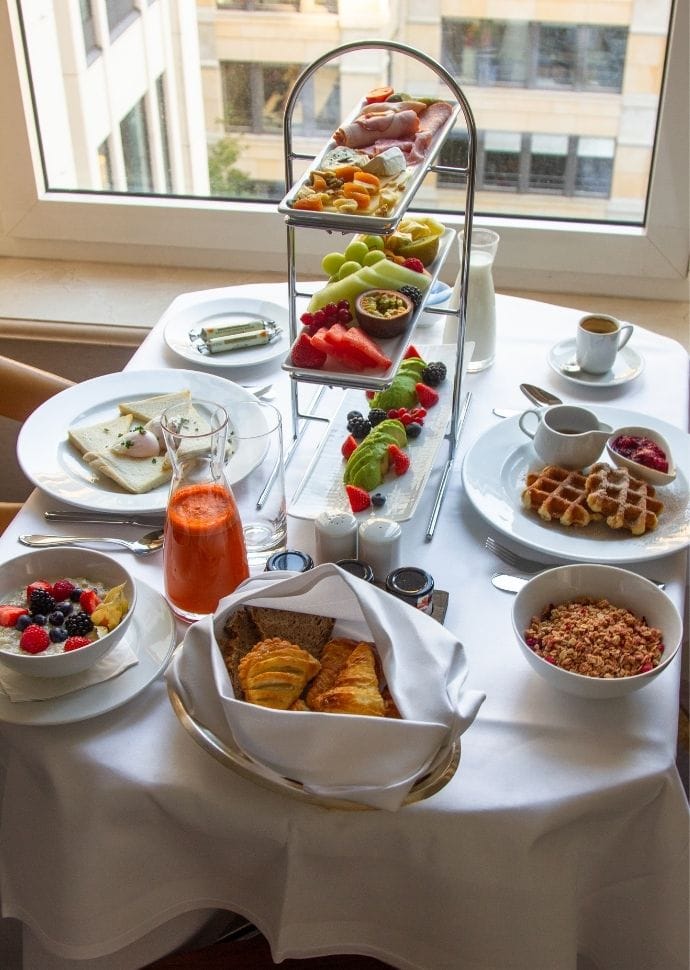 the ritz carlton berlin in room breakfast served on the table.