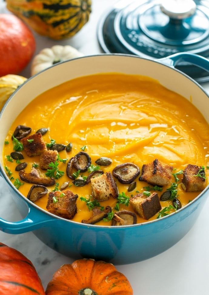 vegan pumpkin soup and white beans topped with croutons and sauteed shiitake mushrooms.