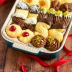 italian butter cookies with various toppings and decorations.