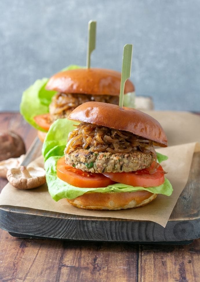 gluten-free mushroom burger topped with caramelized onions, tomatoes and lettuce.