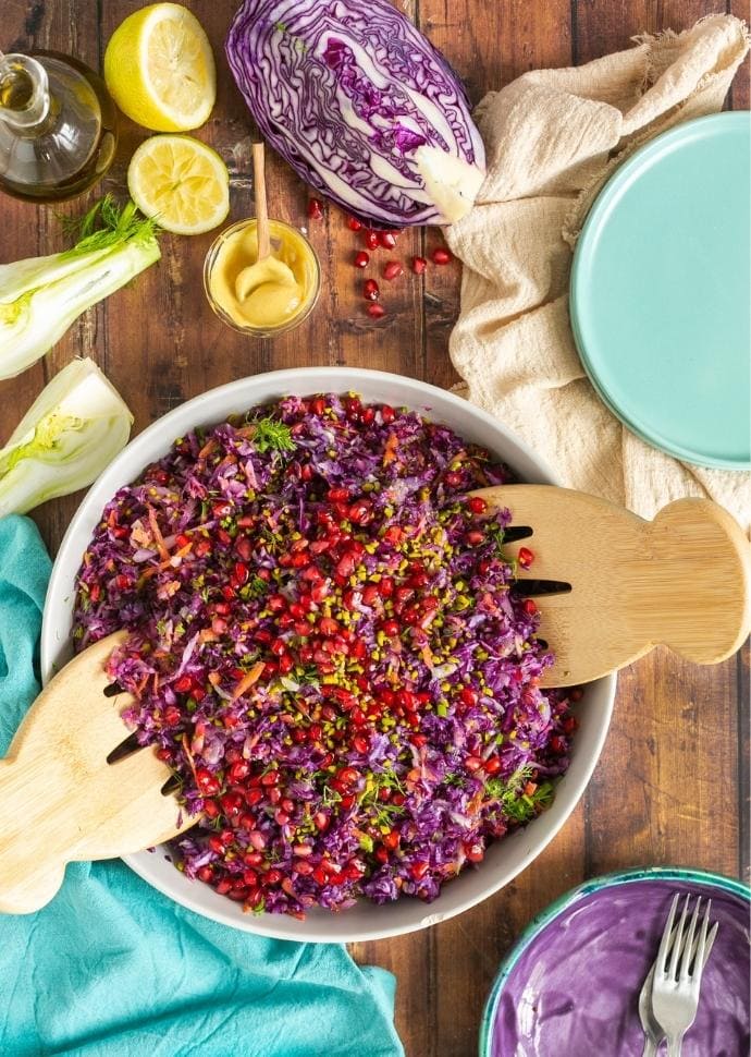 winter coleslaw with pistachio nuts and pomegranate seeds.