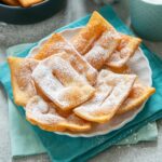 chiacchiere carnival italian fritters dusted with confectioner's sugar.