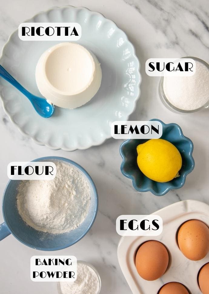 ricotta cake ingredients: ricotta cheese, sugar, lemon, flour, eggs, baking powder.