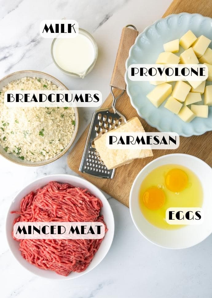 italian meatloaf ingredients: minced meat, eggs, parmesan cheese, breadcrumbs, milk, provolone cheese.