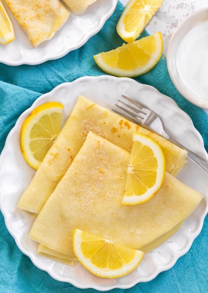 Traditional English pancakes served with lemon and sugar.