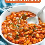 Homemade baked beans in tomato sauce. Image with text for Pinterest.