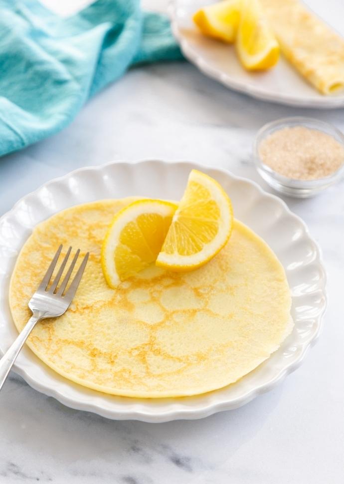 Traditional British Pancake served with lemon on the side.