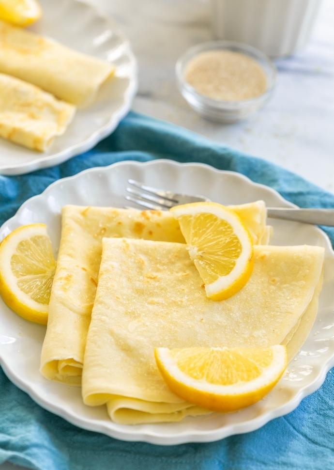 Tradtitional British Pancakes served with lemon wedges and sugar.