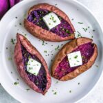 baked purple sweet potatoes served with butter and chive.