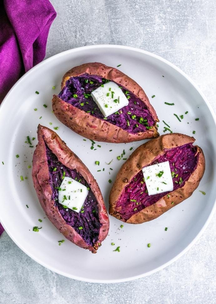 baked stokes purple potatoes with butter and chives.