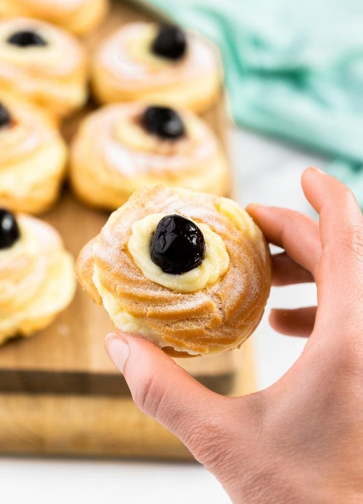 Italian zeppole with pastry cream and wild cherries.