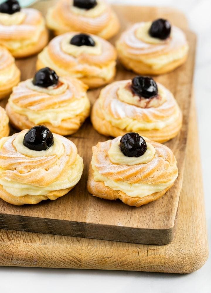 St Joseph zeppole filled with pastry cream and topped with preserved cherries.