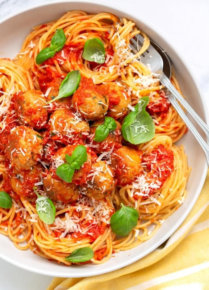 spaghetti and chicken meatballs in tomato sauce.