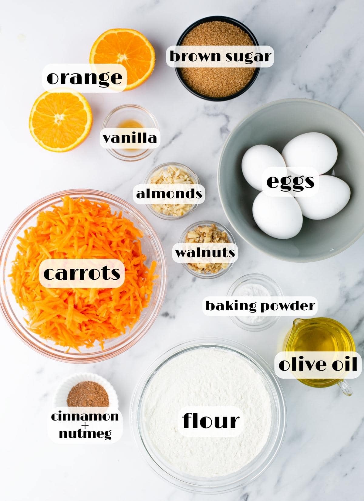carrot cake ingredients: sugar, orange, eggs, almonds, walnuts, oil, flour, baking powder, carrots, vanilla.