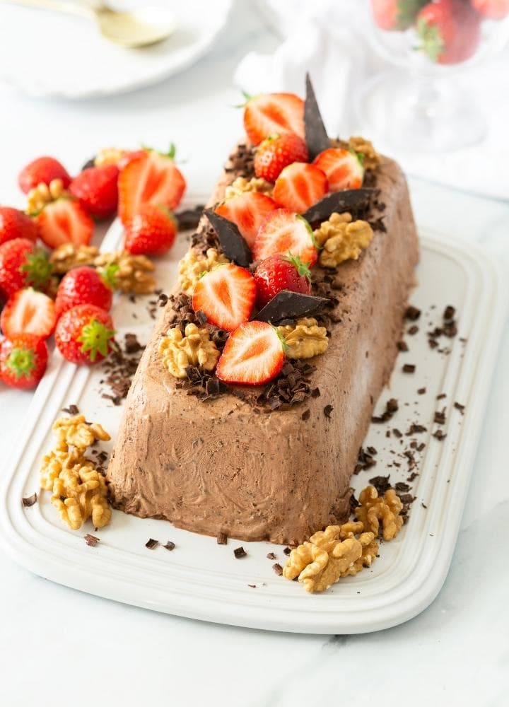 semifreddo with chocolate decorated with walnuts and strawberries.