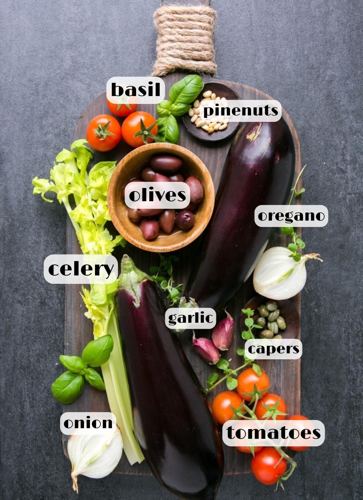 eggplant caponata ingredients: eggplant, celery, tomatoes, capers, onion, basil, olives, garlic.