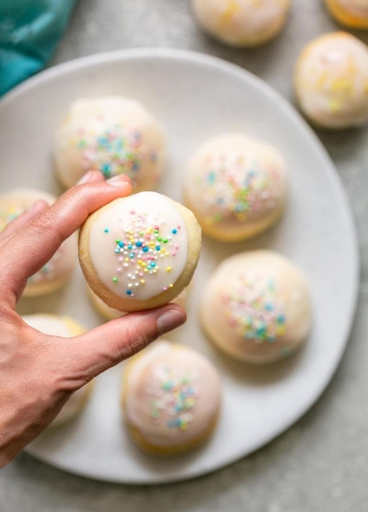 lemon ricotta cookies with icing and sprinkles.