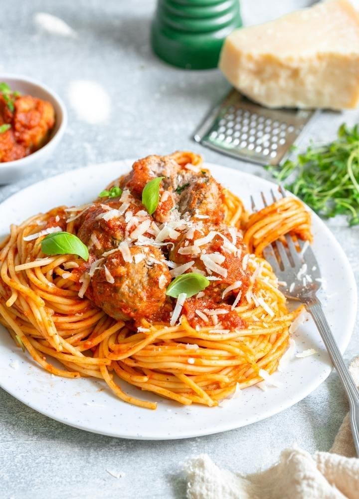 ricotta meatballs in tomato sauce with pasta.