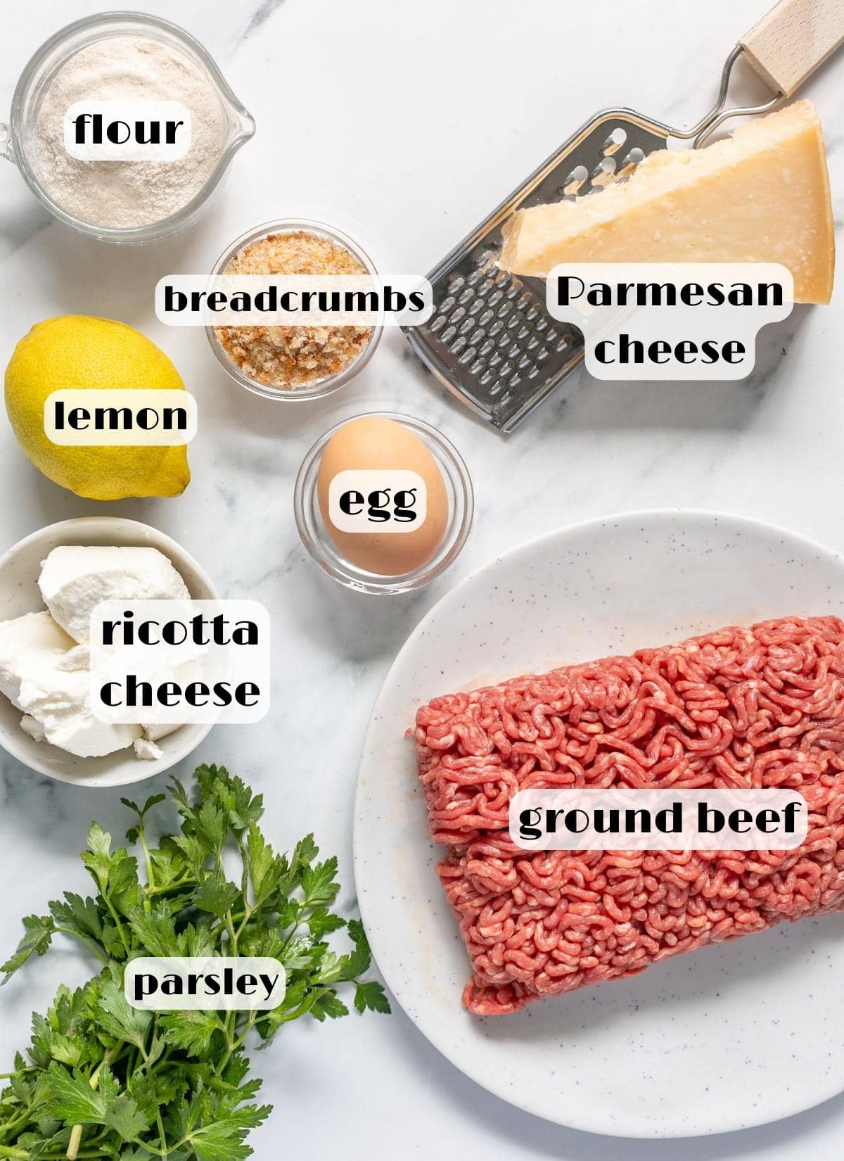ricotta meatballs ingredients: ground beef, ricotta cheese, parmesan cheese, egg, breadcrumbs, lemon, flour, parsley.