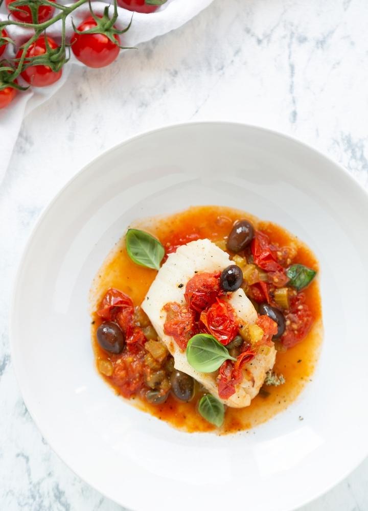 italian fish stew with tomatoes, olives and capers.