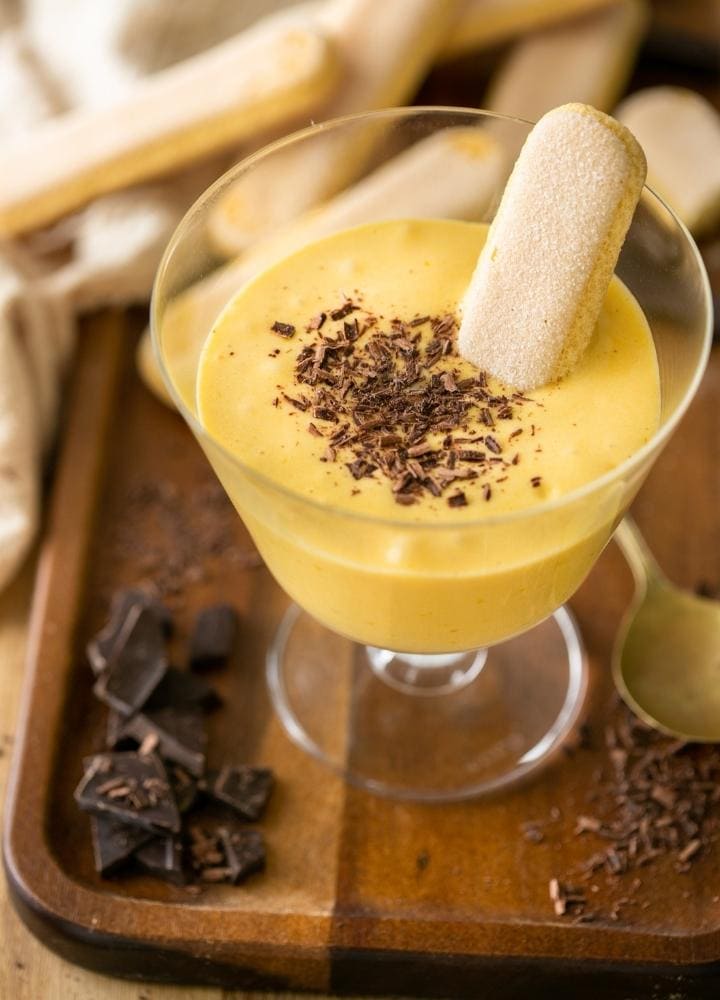 Italian zabaglione or zabaione served with savoiardi (ladyfingers).