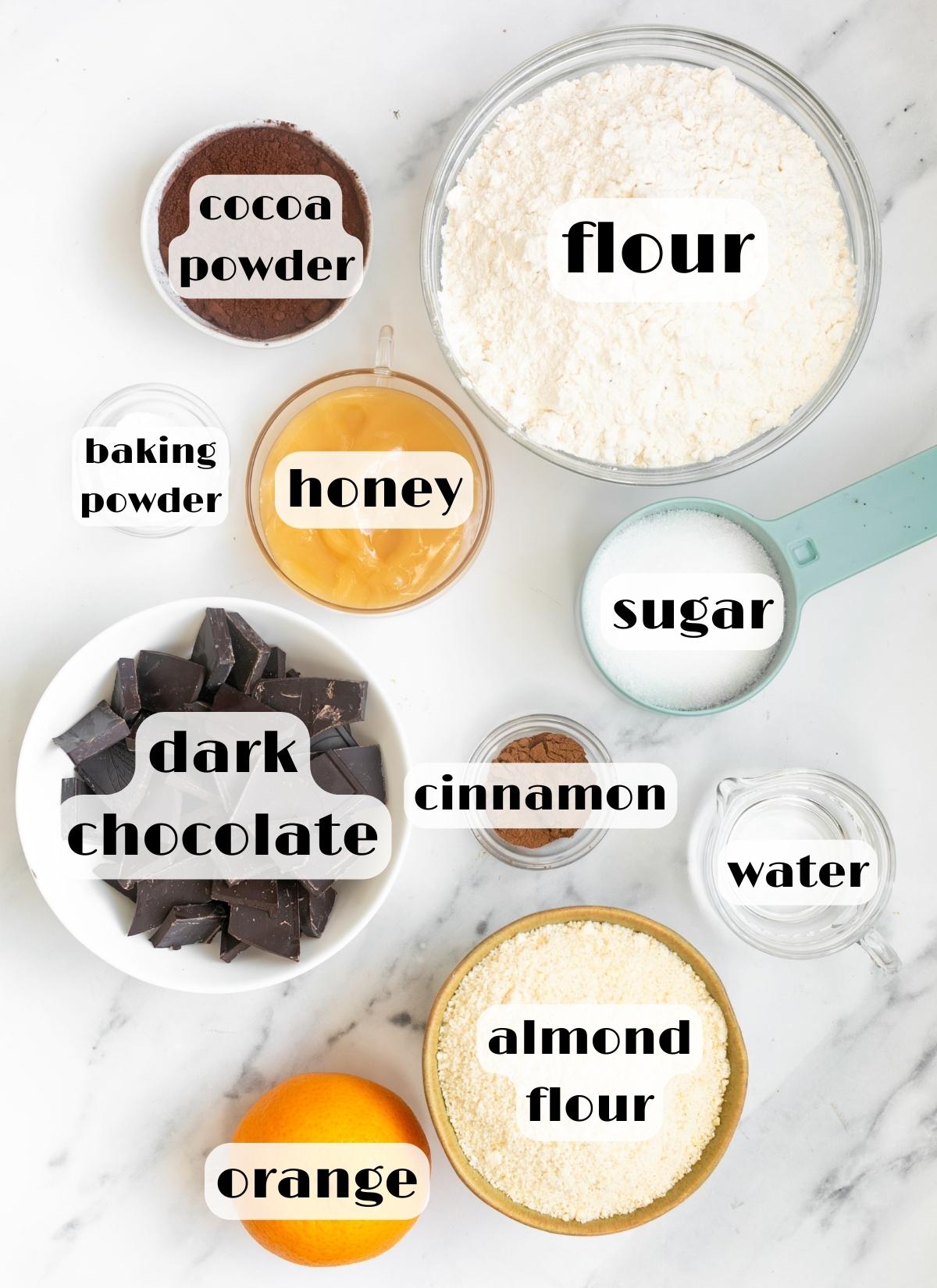 mostaccioli cookies ingredients: flour, orange, honey, sugar, cocoa, chocolate, almond flour, water, baking powder.