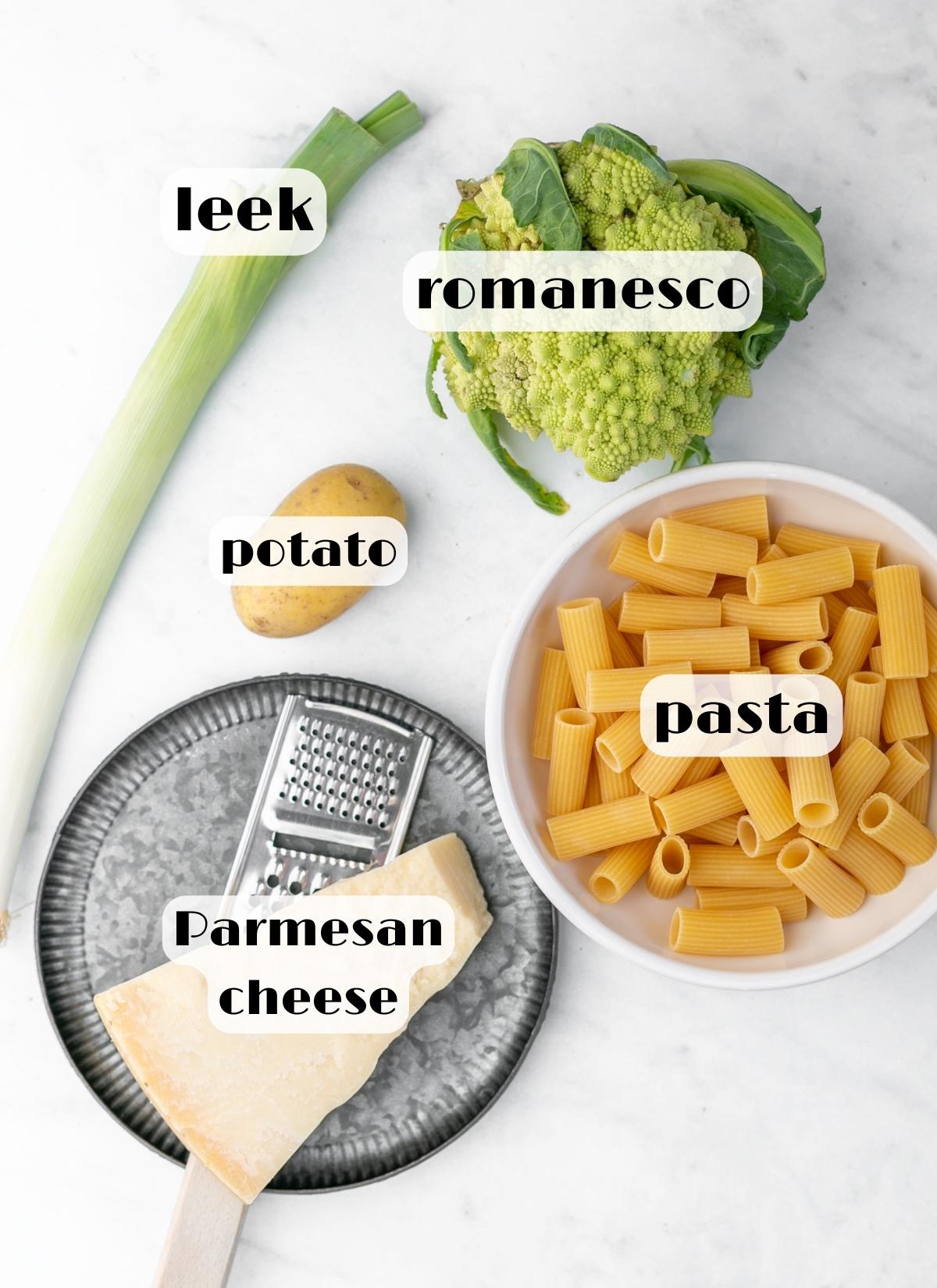 romanesco pasta recipe ingredients: pasta, romanesco broccoli, leek, potato and parmesan cheese.