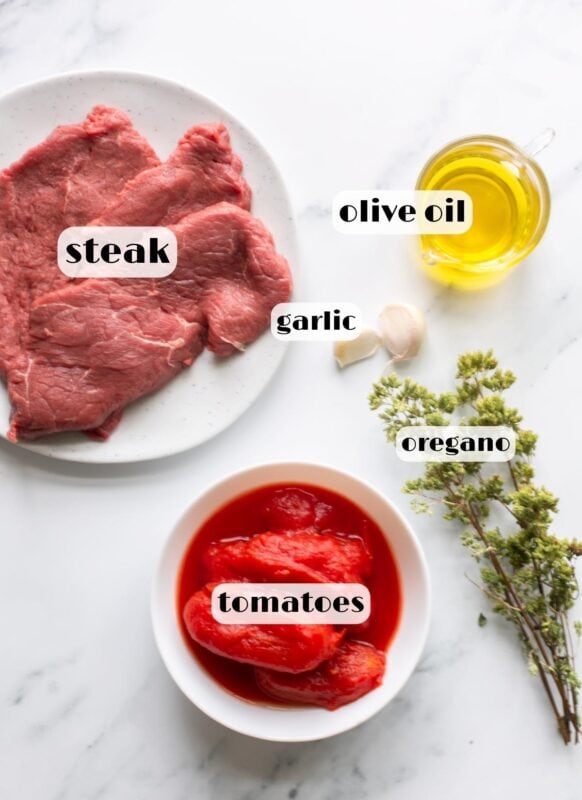 steak pizzaiola ingredients: beef steak, canned san marzano tomatoes, garlic, oregano, extra-virgin olive oil.