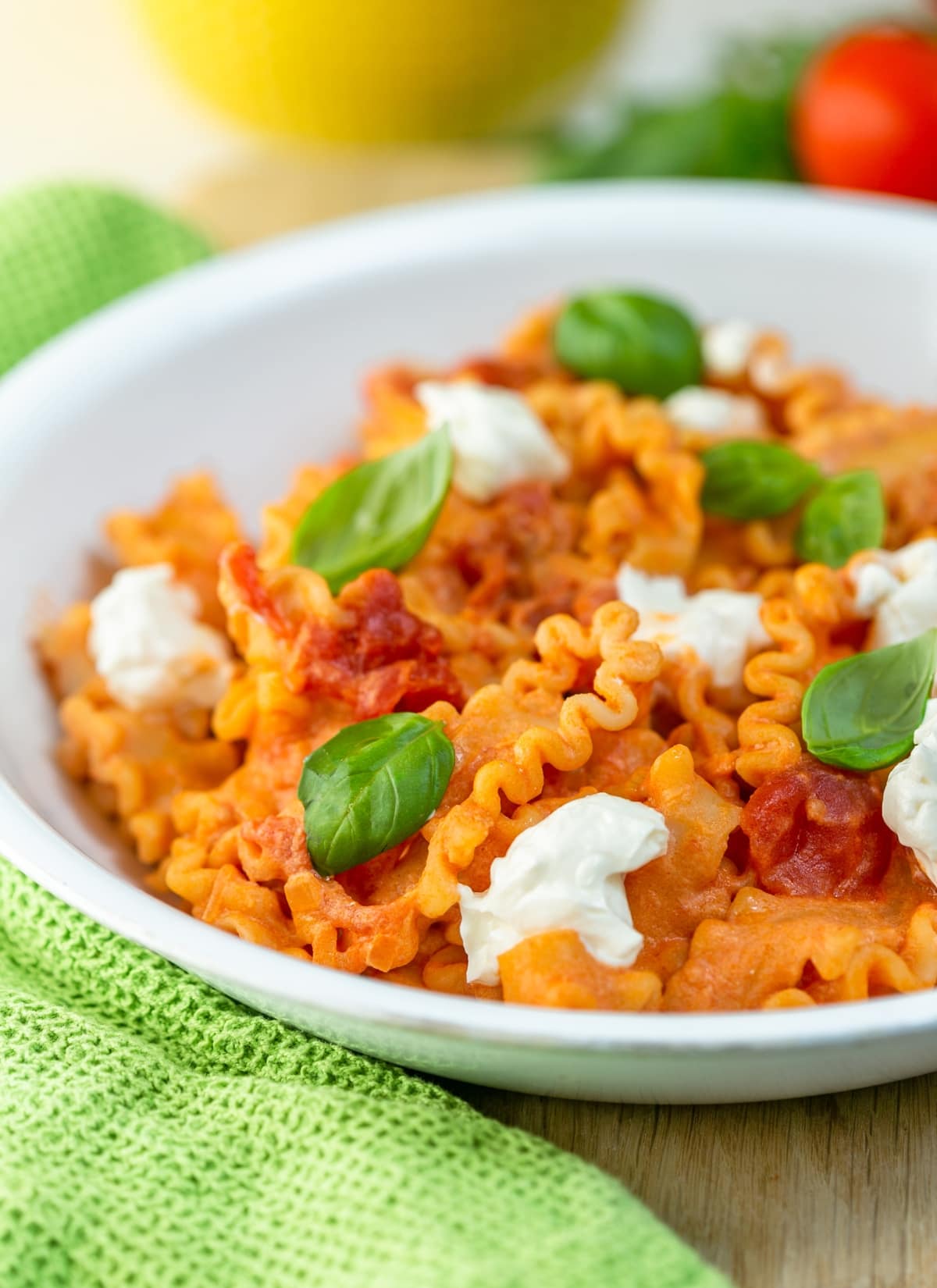 Mafaldine pasta with tomato sauce and ricotta cheese.