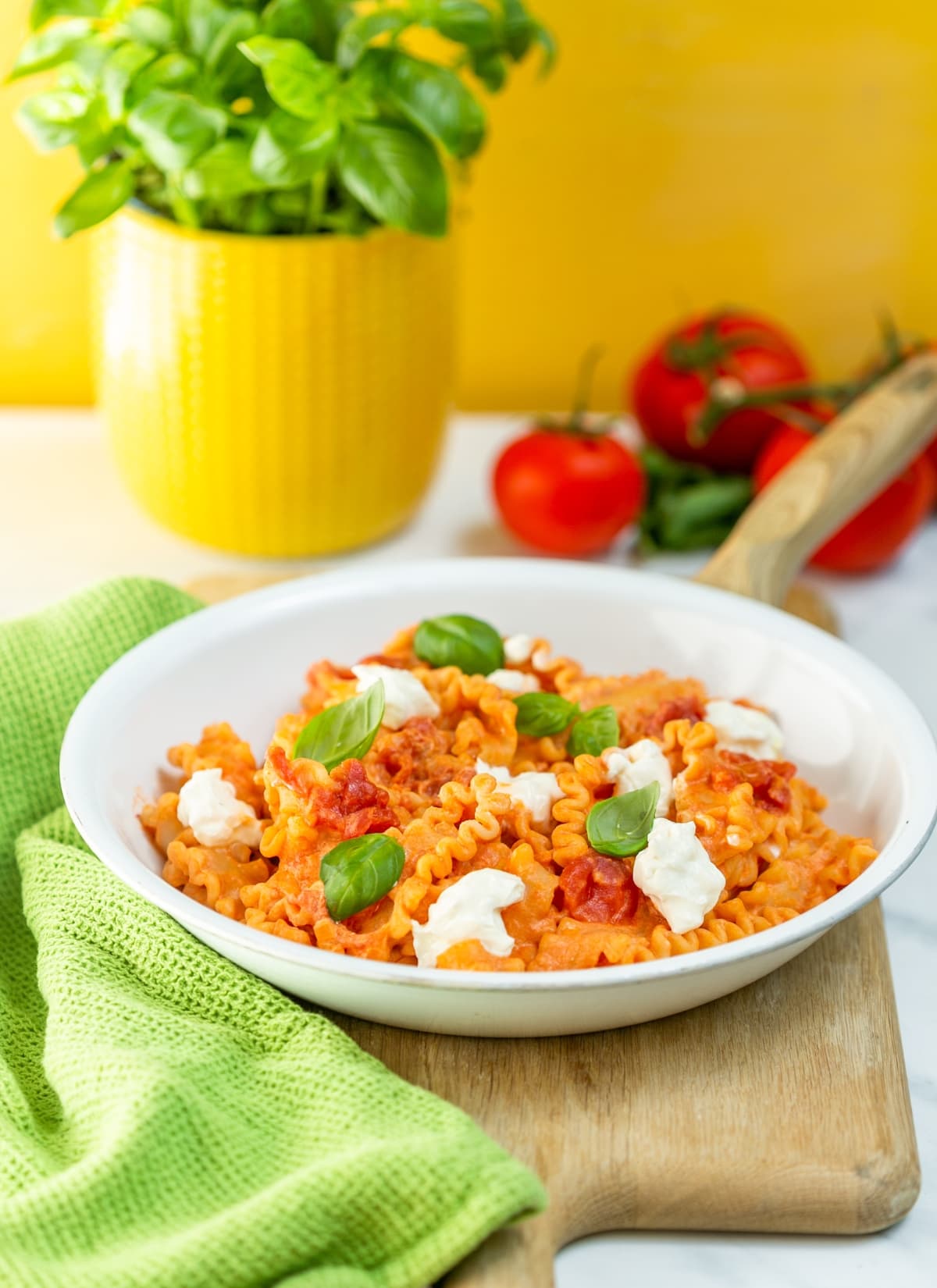 Mafalda pasta with tomato sauce and ricotta cheese.