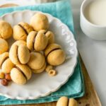 Baci di dama hazelnut cookies. Image with text for Pinterest.