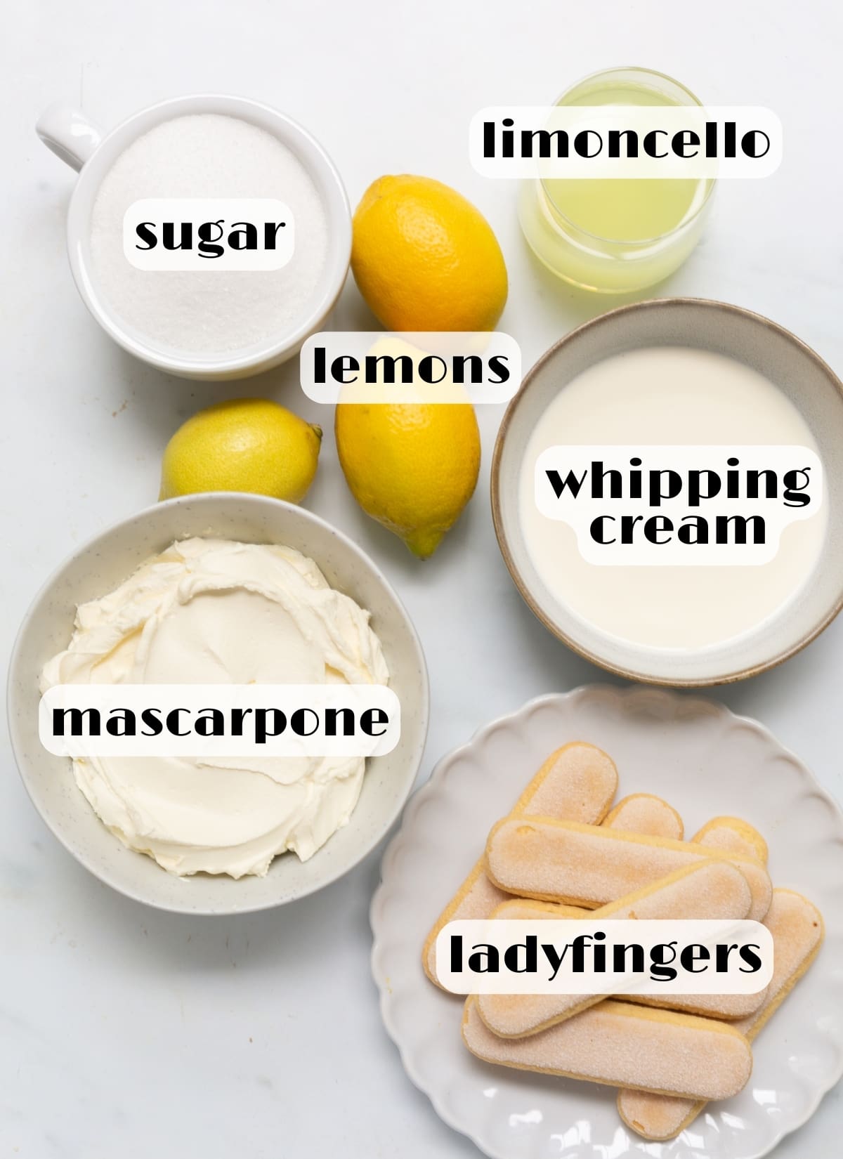 limoncello tiramisu ingredients: mascarpone, whipping cream, sugar, lemons, limoncello, ladyfingers.