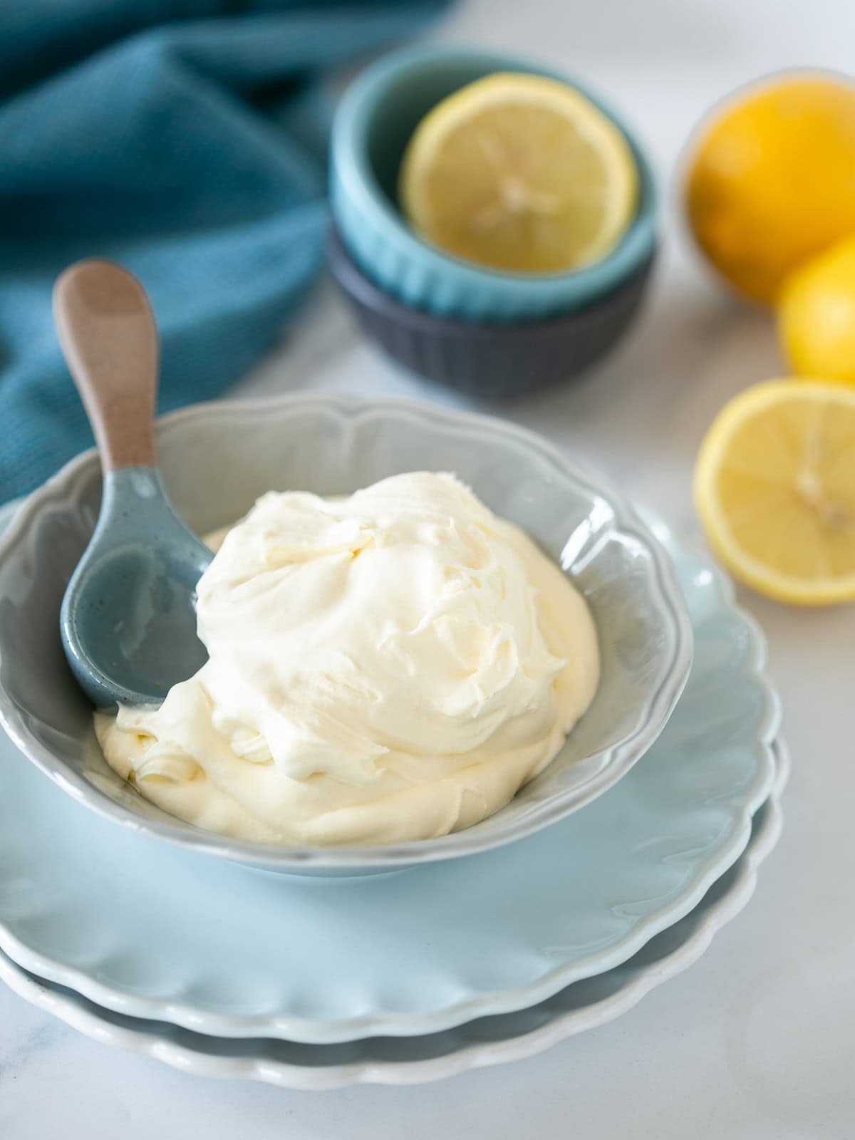 Creamy mascarpone cheese made from cream and lemon juice, scooped with a spoon
