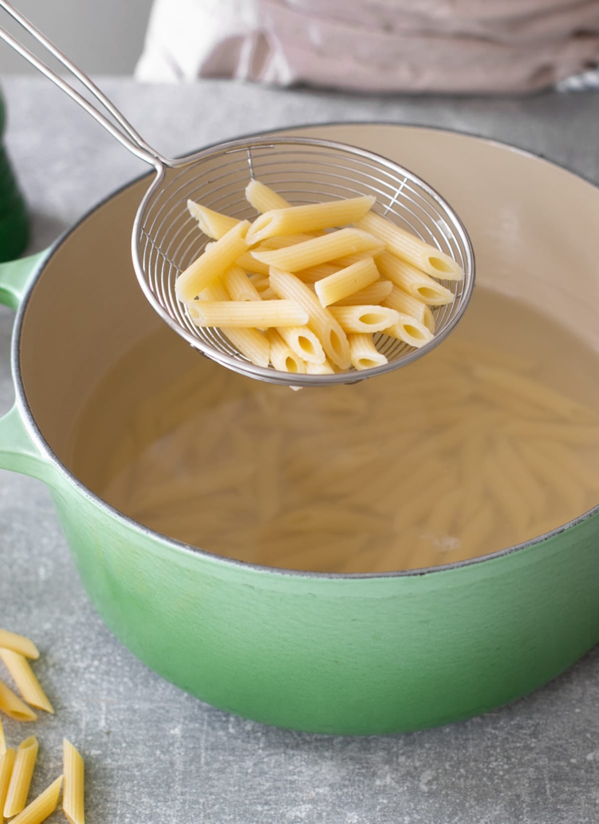 Al dente pasta drained with a colander.