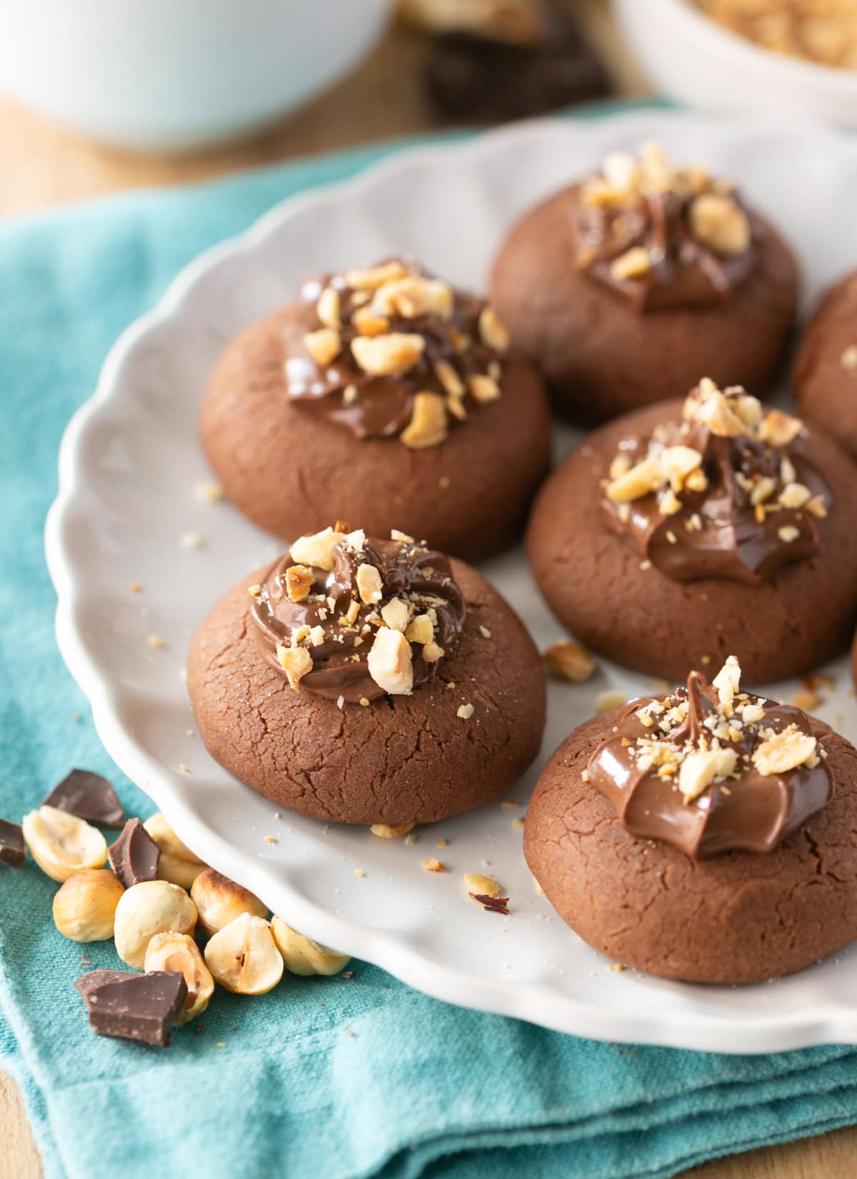 3 ingredient nutella cookies topped with nutella and hazelnuts.