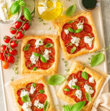 Caprese puff pastry with tomatoes, basil and burrata cheese.