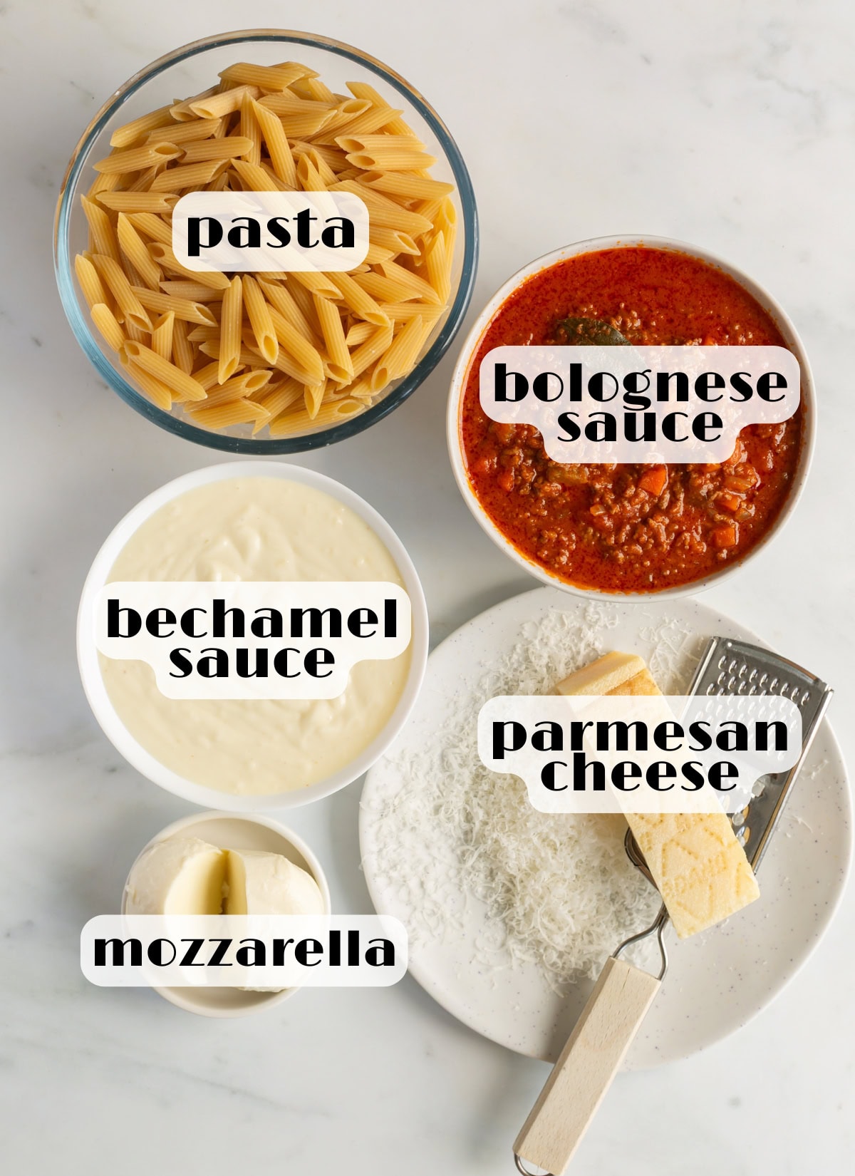 pasta al forno ingredients: pasta, bolognese sauce, bechamel saue, parmesan cheese, mozzarella.