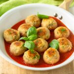 Tuna meatballs served with tomato sauce.