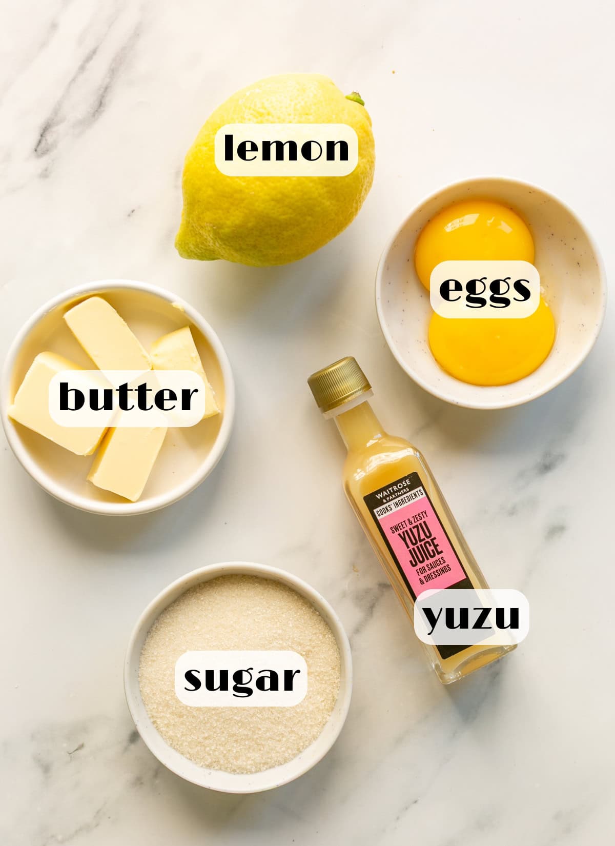 yuzu curd ingredients: yuzu juice, sugar, lemon, egg yolks, butter.