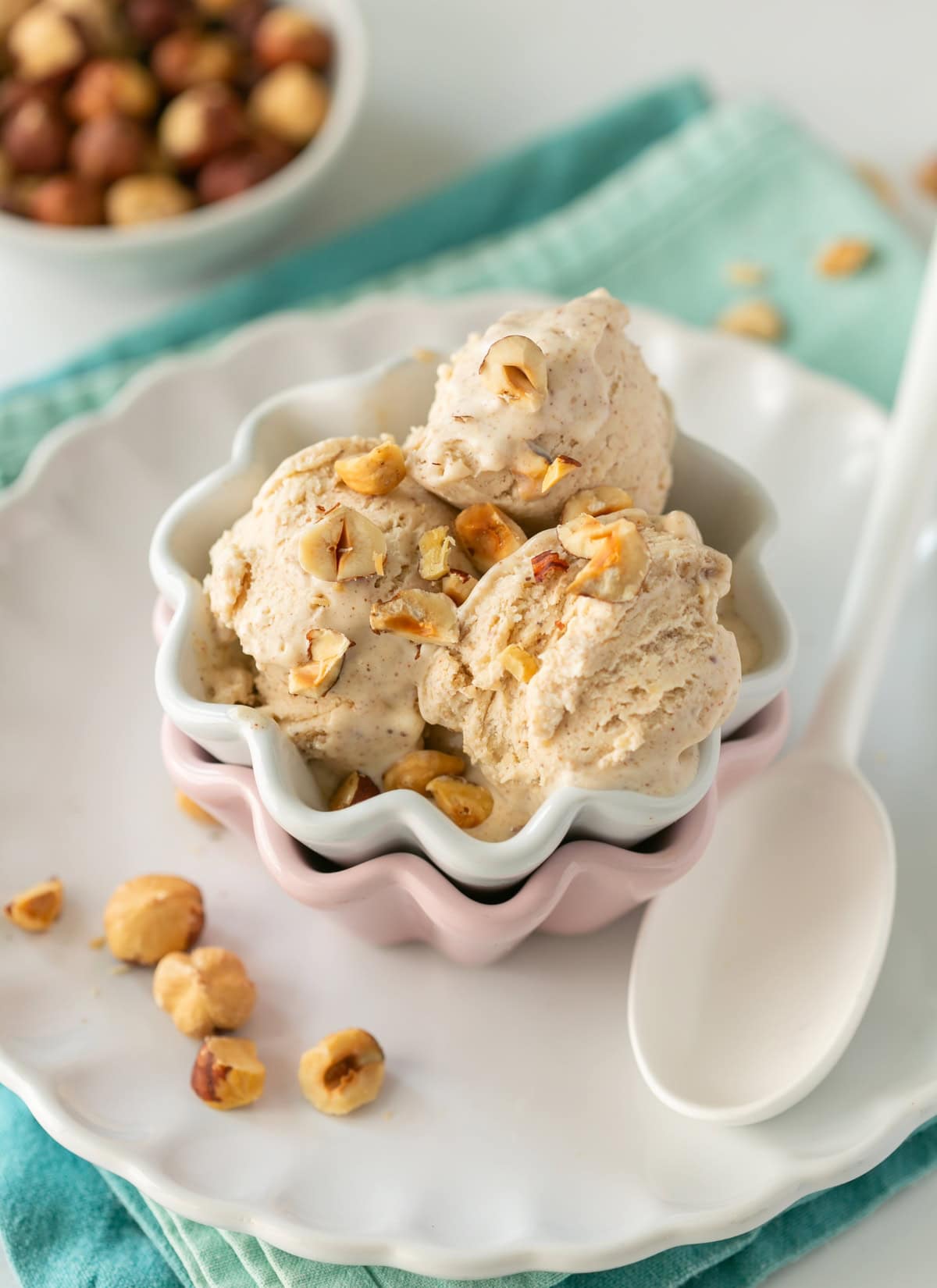 hazelnut gelato topped with chopped hazelnuts.