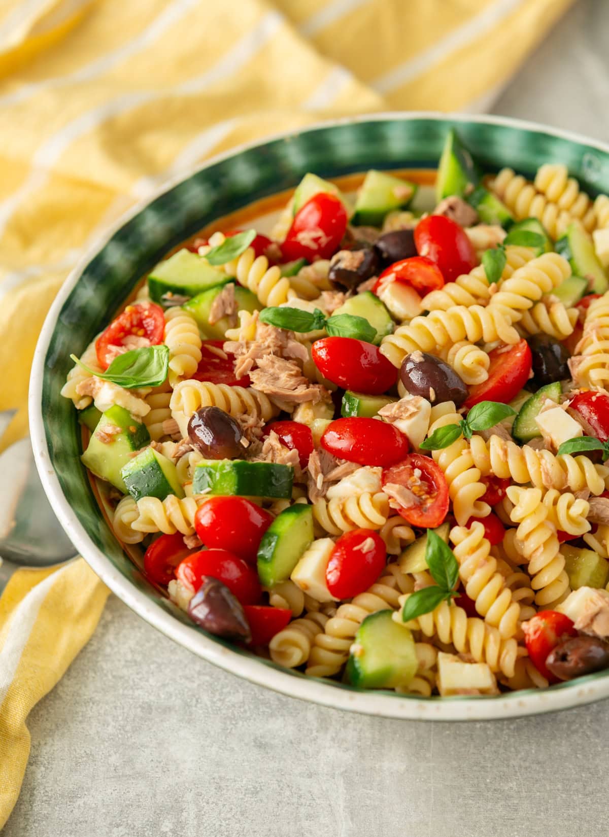 Italian-style tuna pasta salad with tomatoes, cucumber, mozzarella.