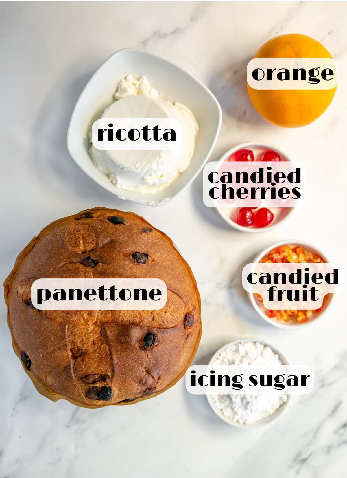 christmas cannoli ingredients: panettone, ricotta, orange, icing sugar, candied fruit, candied cherries.