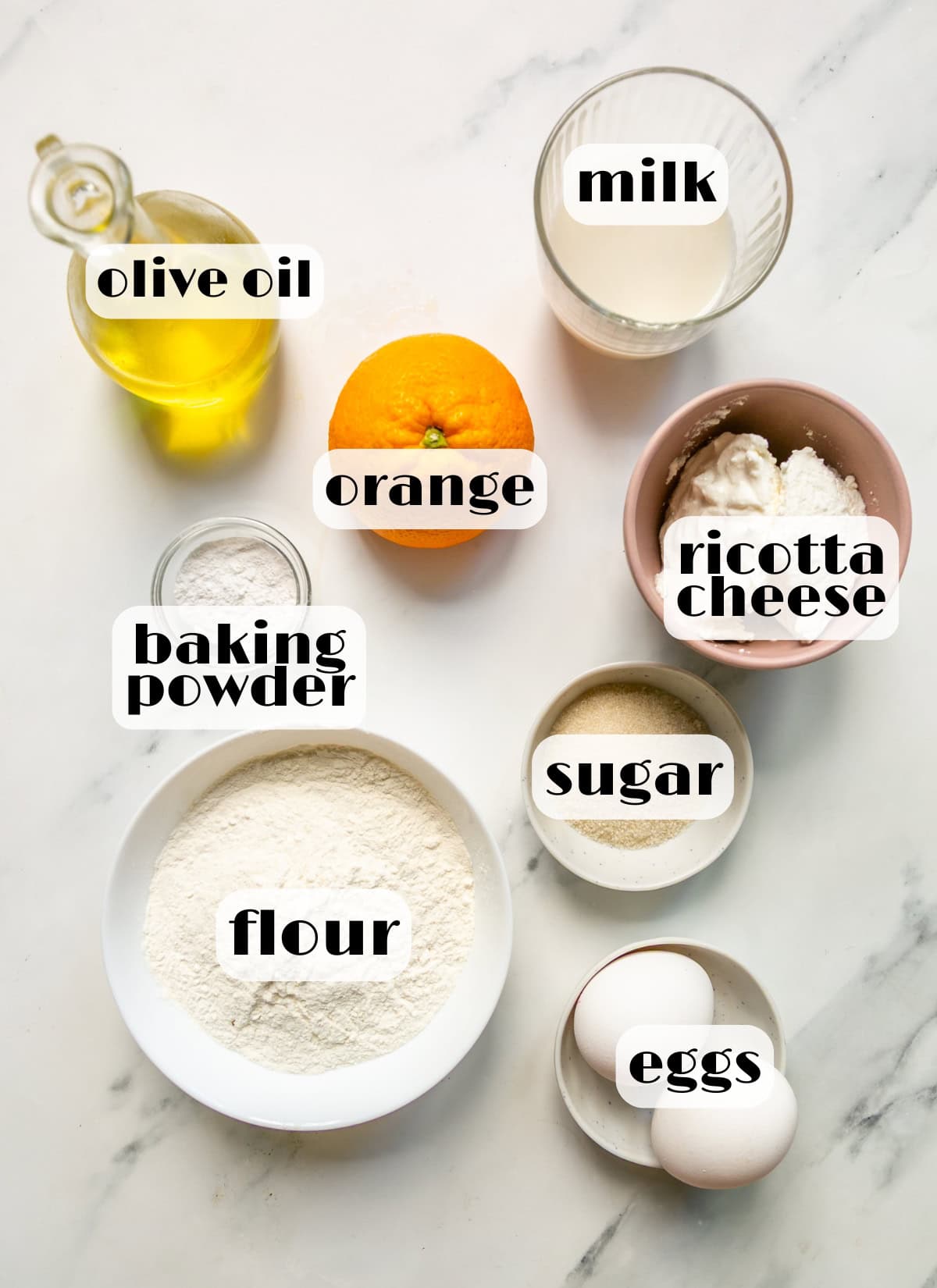 orange pancakes ingredients: flour, ricotta cheese, olive oil, baking powder, eggs, sugar, milk.